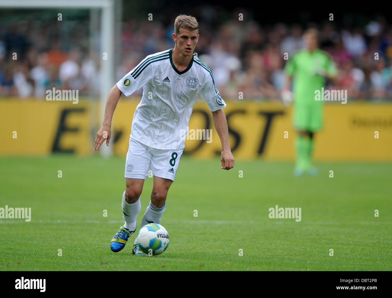 Lippstadt, Germany. 03rd Aug, 2013. Leverkusen's Lars Bender plays the ball during the first round DFB Cup match between SV Lippstadt 08 and Bayer Leverkusen at the Am Waldschloesschen stadium in Lippstadt, Germany, 03 August 2013. Photo: Jonas Guettler/dpa/Alamy Live News Stock Photo