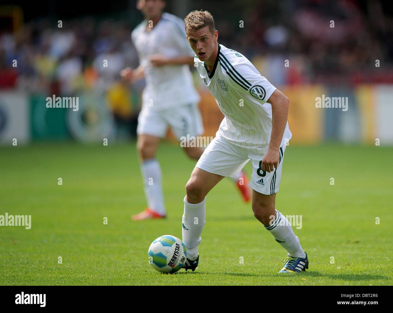 Lippstadt, Germany. 03rd Aug, 2013. Leverkusen's Lars Bender plays the ball during the first round DFB Cup match between SV Lippstadt 08 and Bayer Leverkusen at the Am Waldschloesschen stadium in Lippstadt, Germany, 03 August 2013. Photo: Jonas Guettler/dpa/Alamy Live News Stock Photo