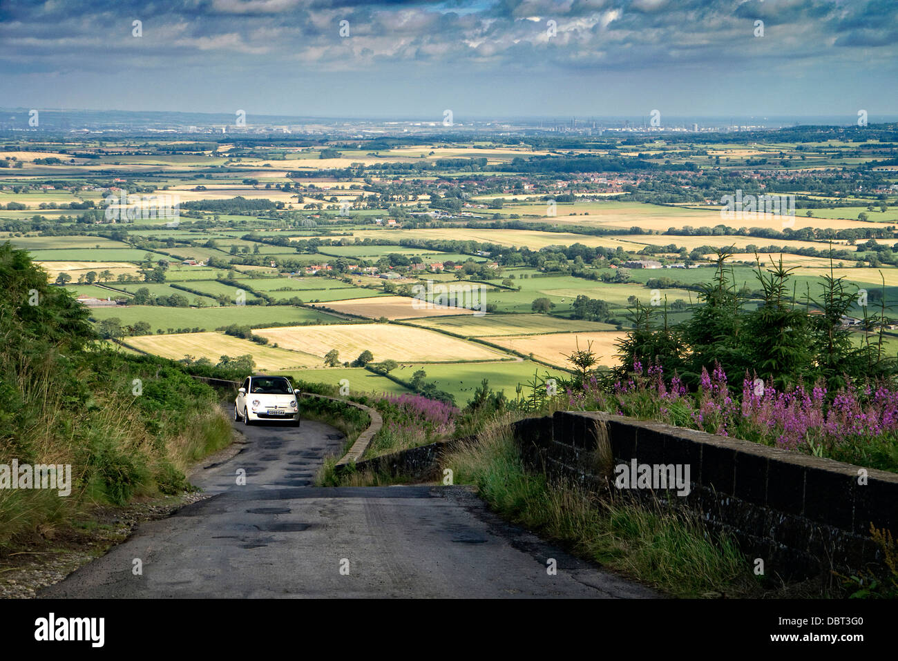 Fiat 500 driving into the North York Moors towards Grosmont Stock Photo