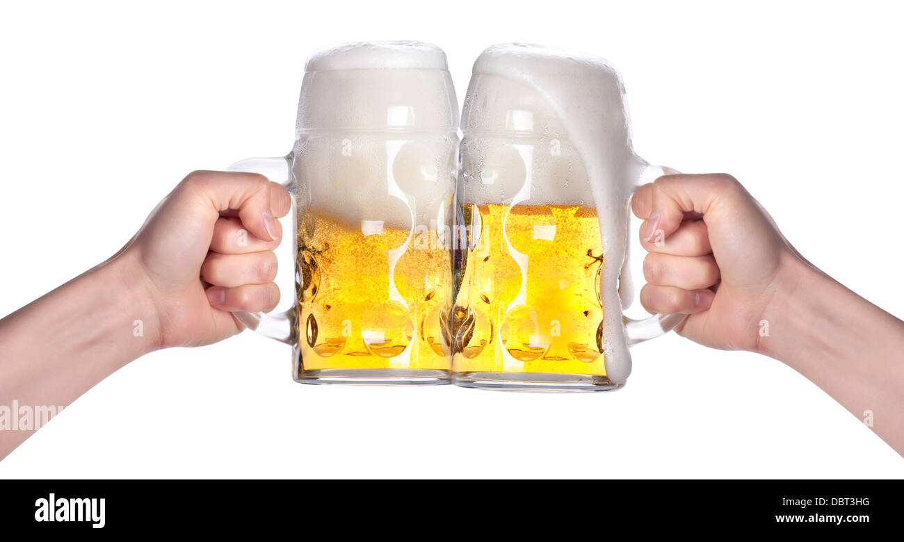 two hands holding beers making a toast Stock Photo
