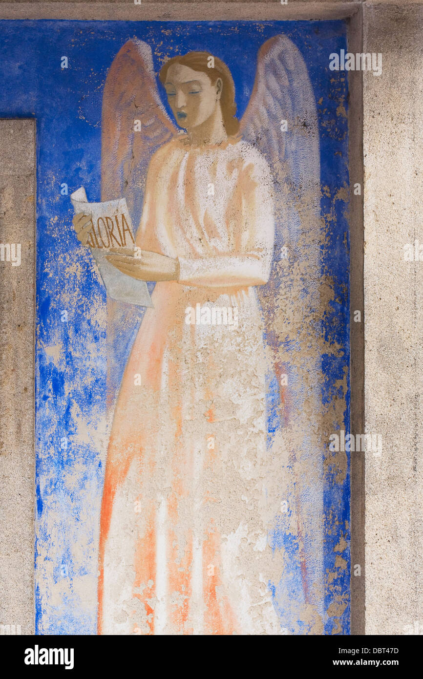 Painting of an angel on the church in the new village of Oradour-sur-Glane. Stock Photo