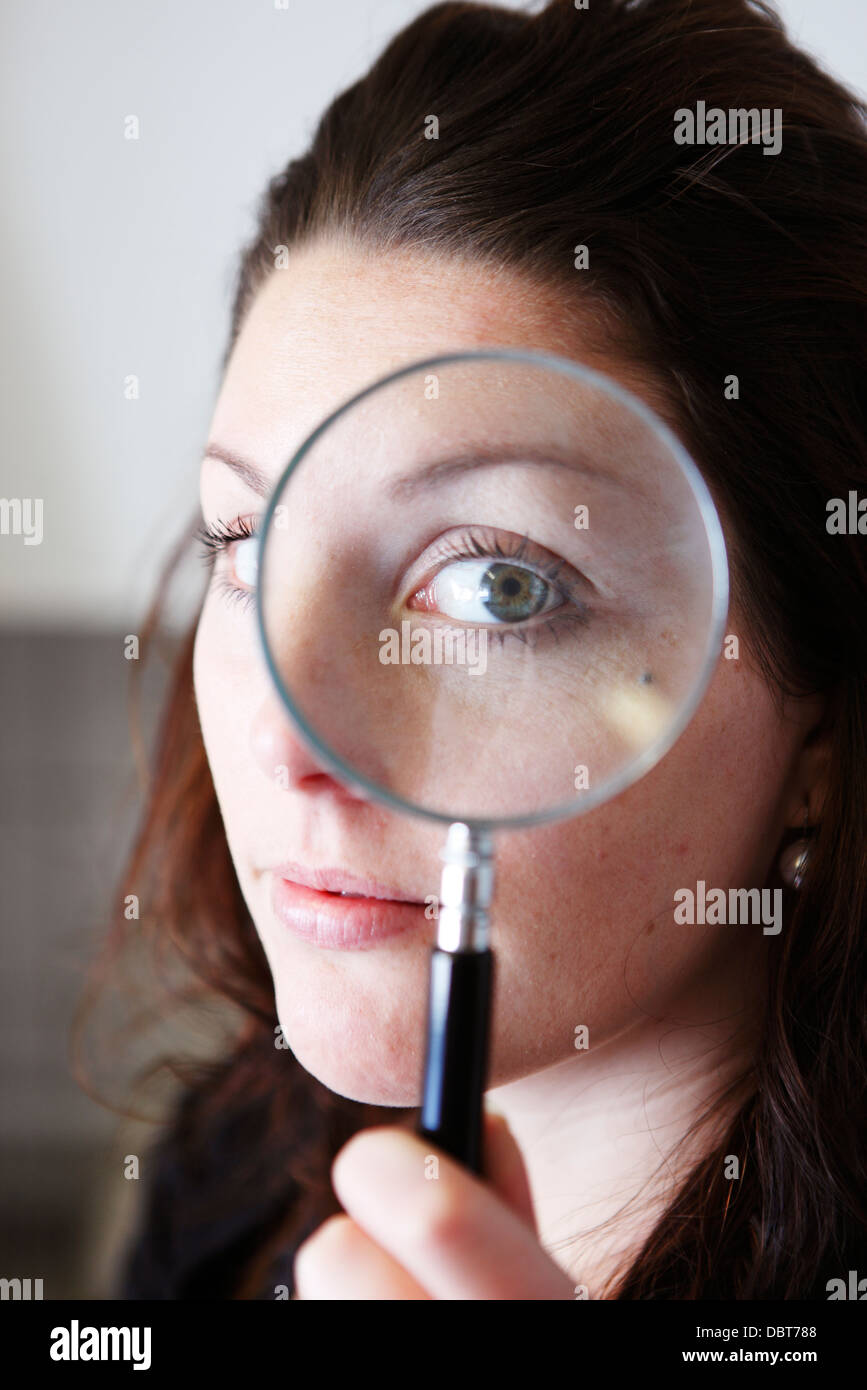 Magnifying glass over eye hi-res stock photography and images - Alamy