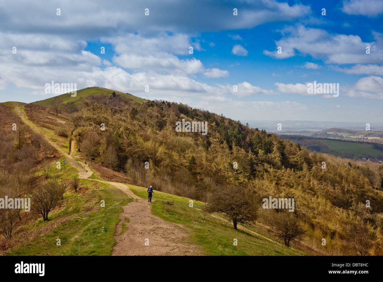 A solitary male walks south towards Pinnacle Hill in the Malvern Hills, Herefordshire, England, UK Stock Photo