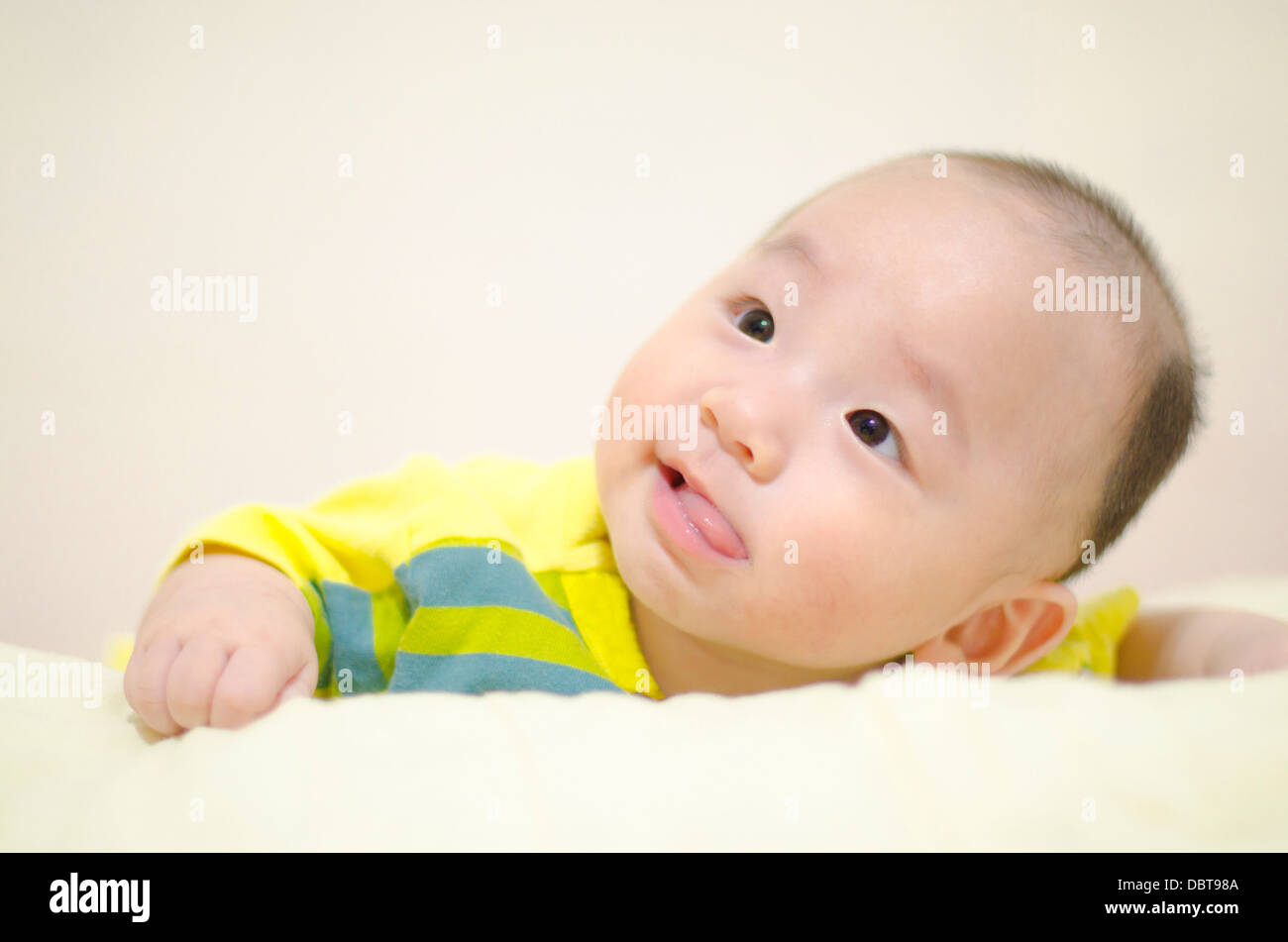 Cute infant smiling Stock Photo