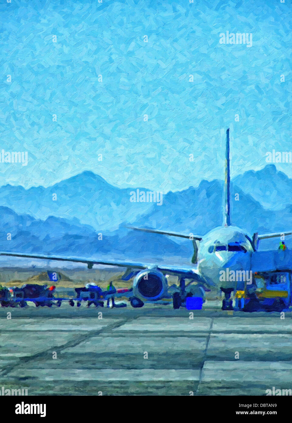 An aeroplane being loaded with luggage at hurghada airport with the red sea mountains in the background Stock Photo