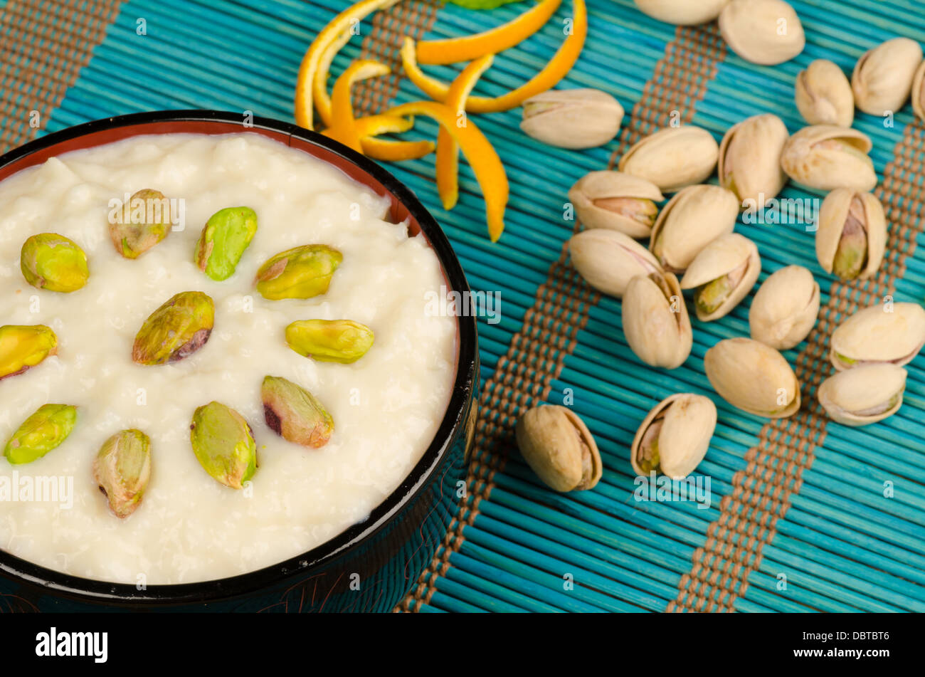 Indian rice pudding with pistachios, homemade dessert Stock Photo Alamy