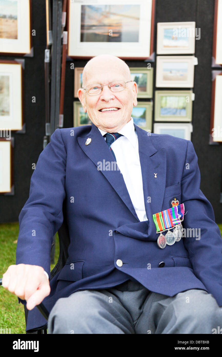 Woodhall Spa. 4th August, 2013. Woodhall Spa 1940's weekend 4/08/2013 Lincolnshire Village UK England. War medals on blazer of war veteran world war 2  Credit:  Paul Thompson Live News/Alamy Live News Stock Photo