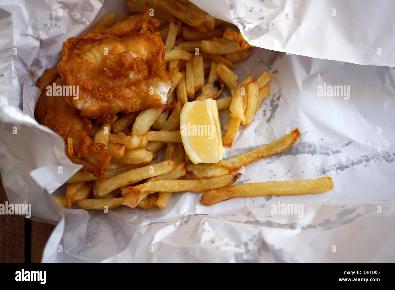 Fish, chips in paper wrapping from restaurant at Kalk Bay ...