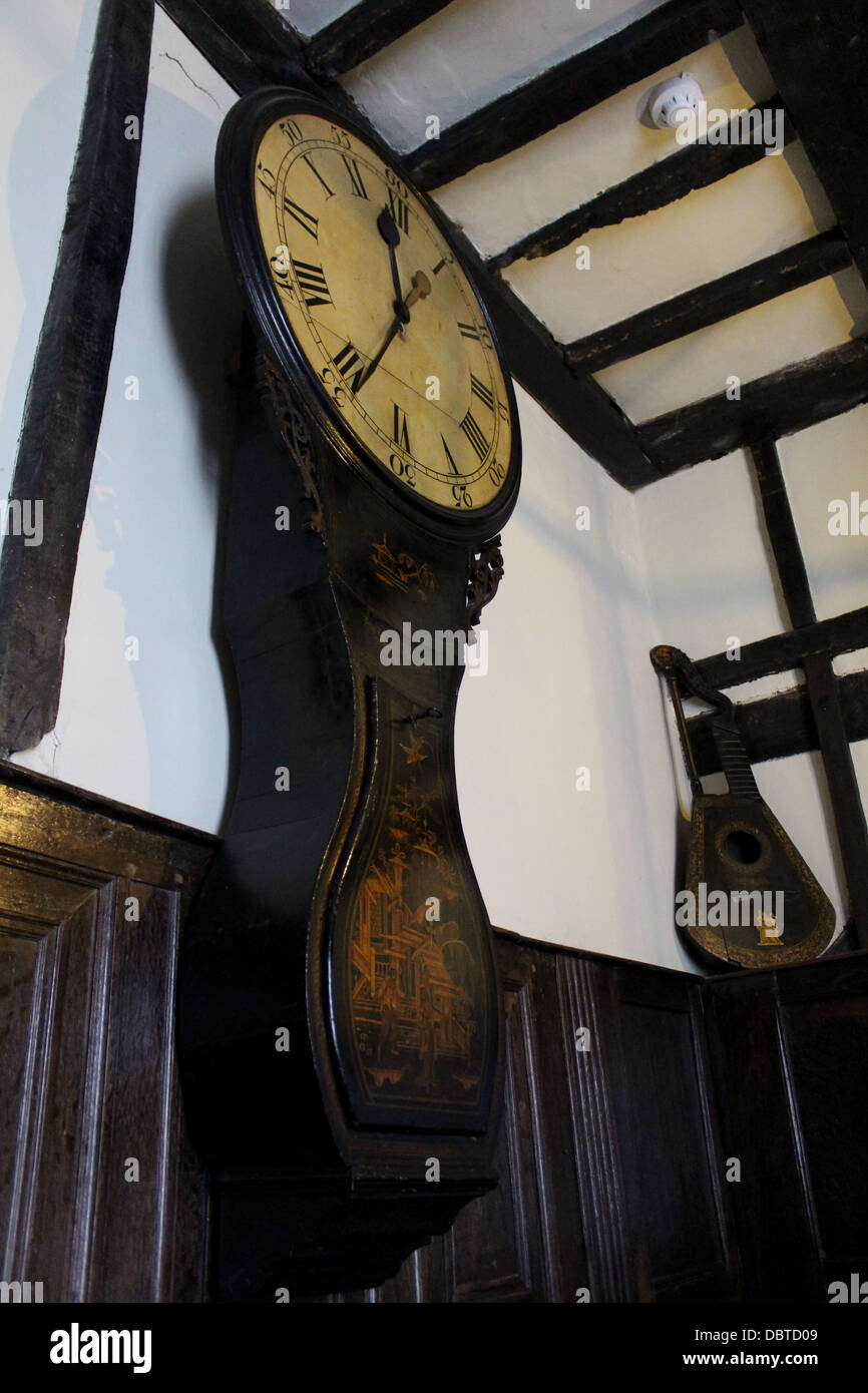 Antique Wall Clock in a traditional English house with an oak beamed