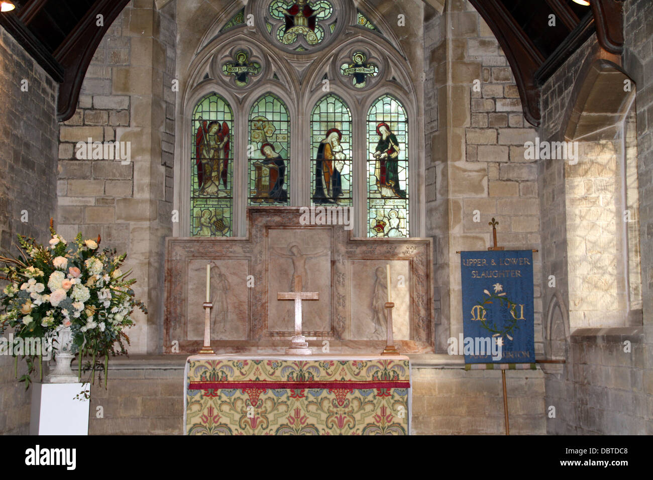 Church alter and stain glass window Stock Photo