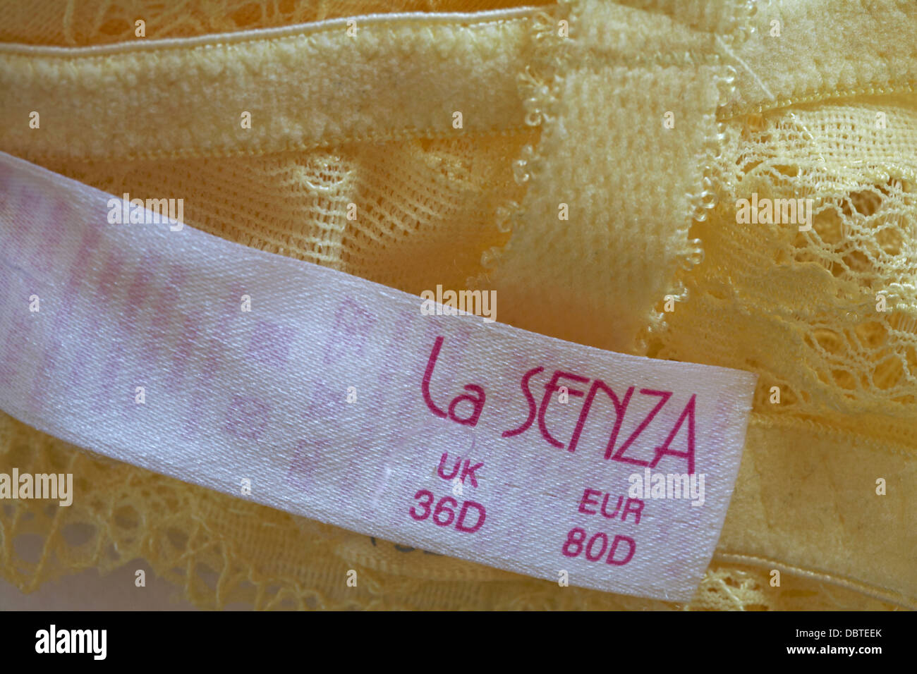 La Senza label in woman's yellow bra Stock Photo - Alamy