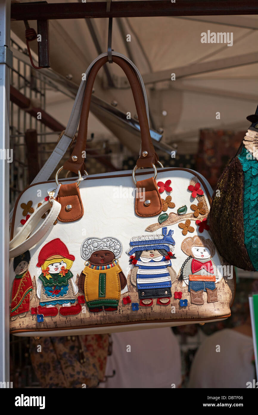 hanging bag with children of different race culture on display at New Forest & Hampshire County Show in August Stock Photo