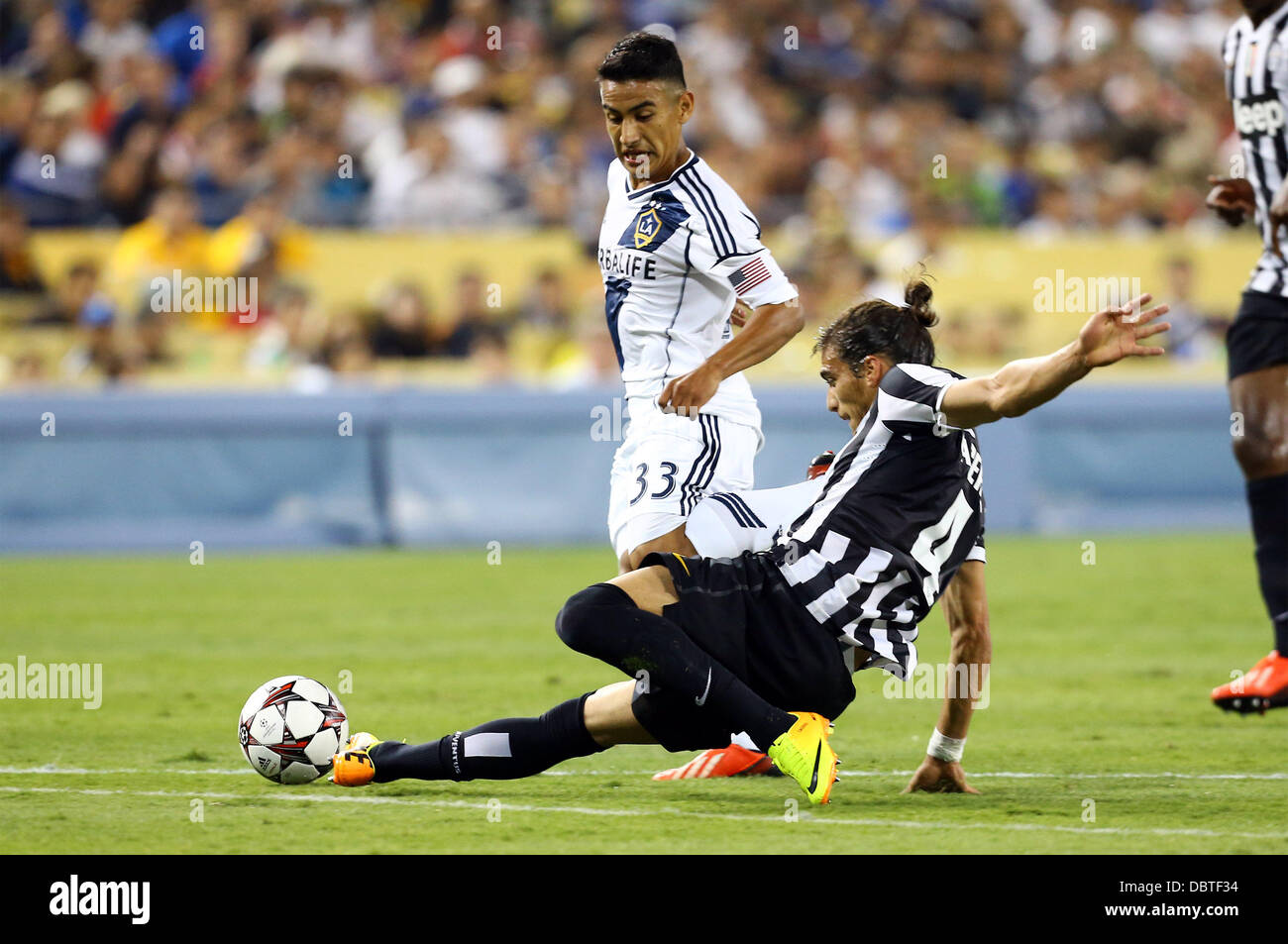 Los Angeles, California, USA. 3rd Aug, 2013. August 3, 2013 Los Angeles, California: Juventus defender Martin Caceres (4) moves the ball in action during Match 6 of the Guinness International Champions Cup Soccer game between Juventus and LA Galaxy at Dodger Stadium on August 3, 2013 in Los Angeles, California. Rob Carmell/CSM/Alamy Live News Stock Photo