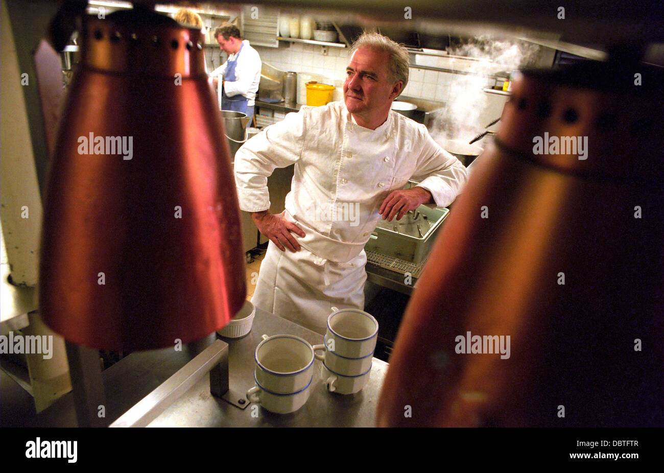 Chef Rick Stein in the kitchen of his restaurant in Padstow, Cornwall, UK. FAST FILM USED. Stock Photo