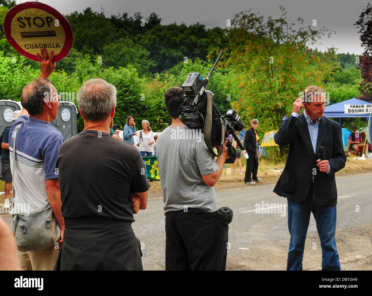 BBC's Duncan Kennedy is deafened by protestor at Balcombe, Sussex UK, anti fracking protest as Cuadrilla start test drilling. Stock Photo