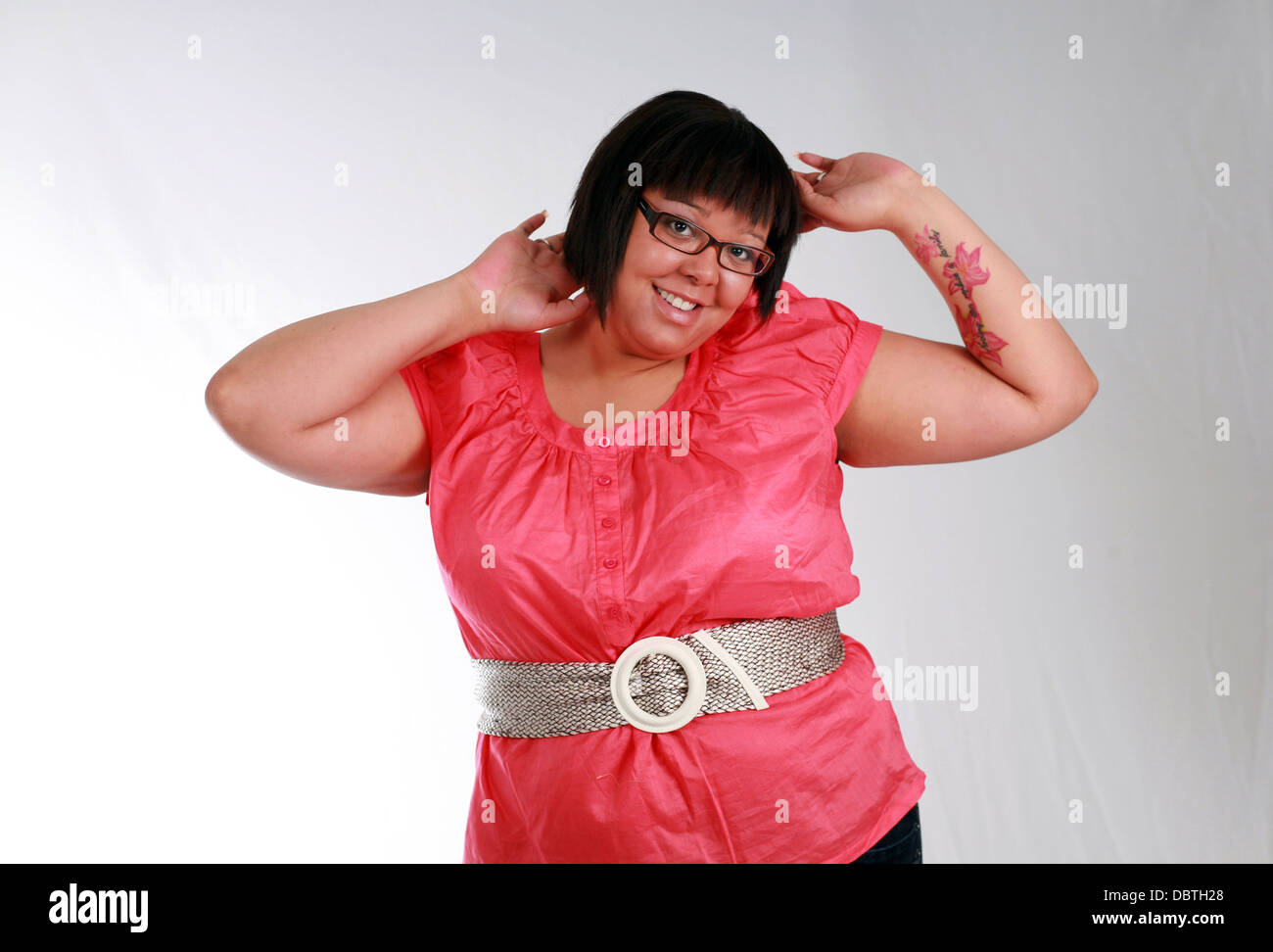 plus size black model with tattoo smiling Stock Photo