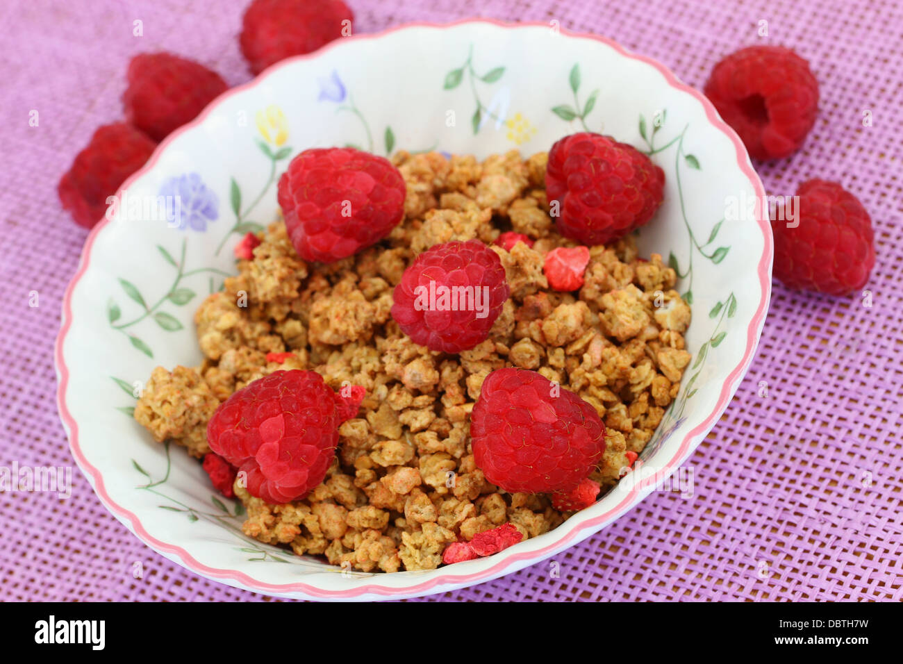 Breakfast cereal with fresh raspberries, close up Stock Photo Alamy