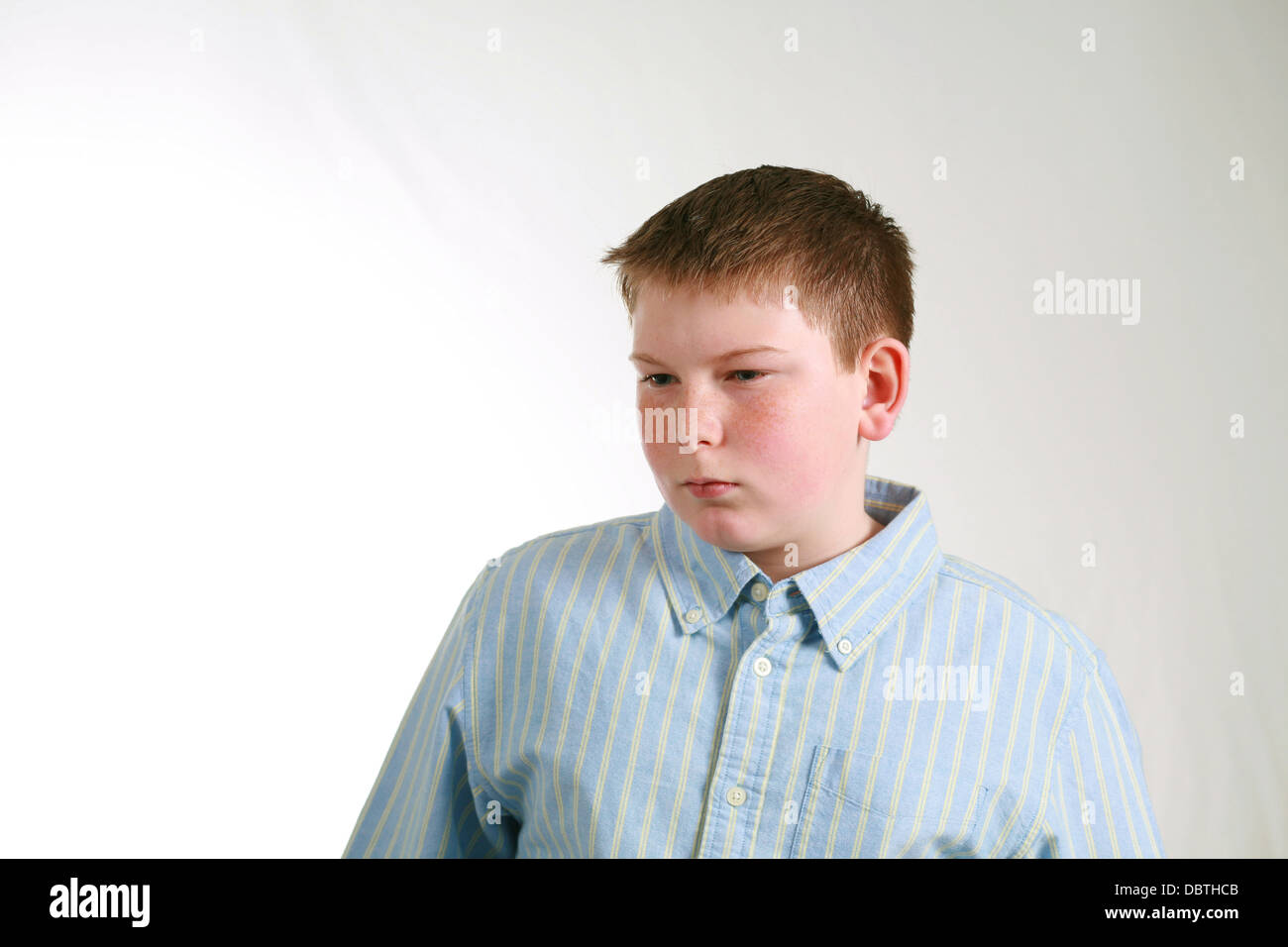 portrait of husky boy with freckles looking off in distance Stock Photo Alamy