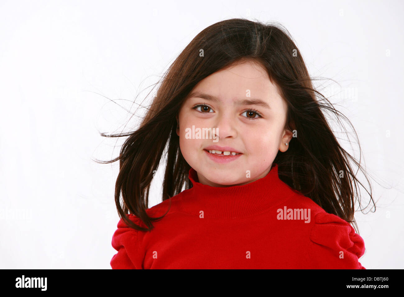 pretty little girl in red shirt looking at camera Stock Photo Alamy