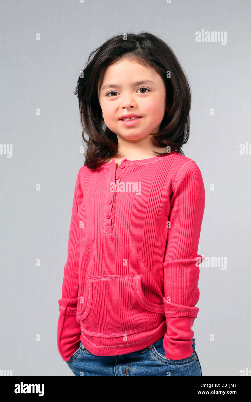 pretty brunette little girl with big eyes smiling Stock Photo - Alamy