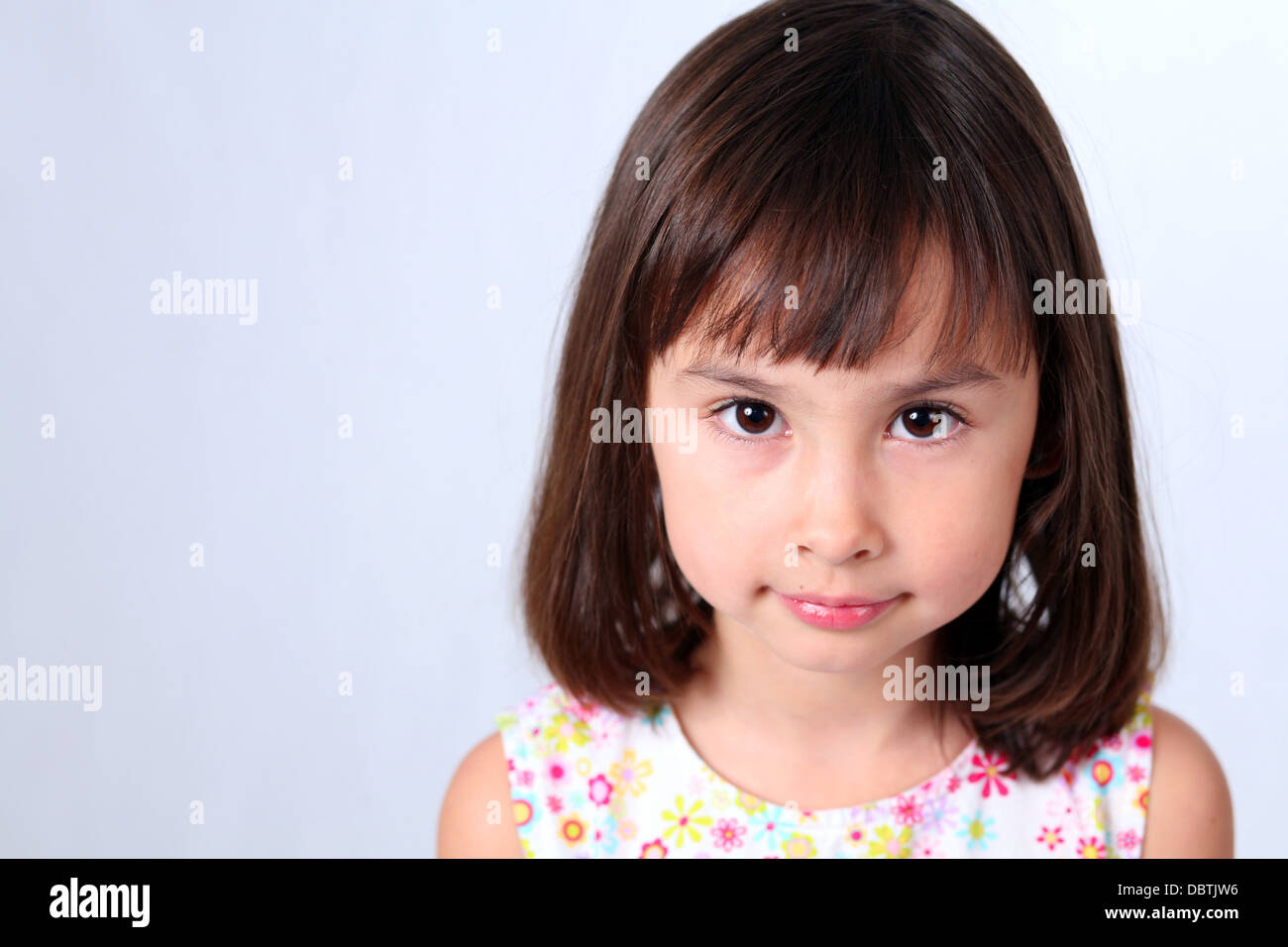 Pretty Brunette Little Girl With Big Brown Eyes Stock Photo