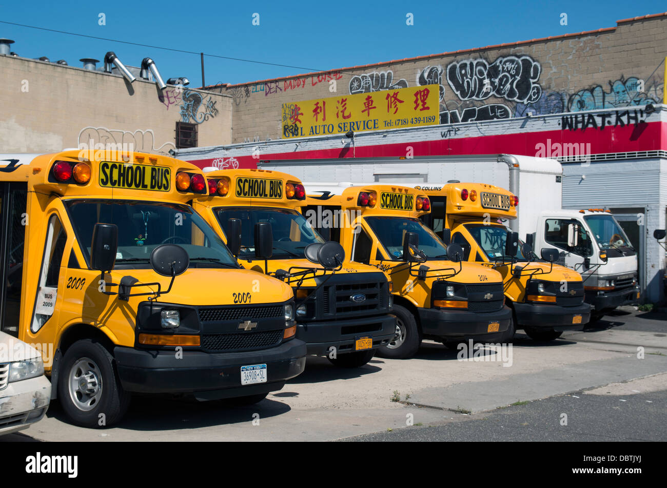School buses in Brooklyn's Chinatown. Stock Photo