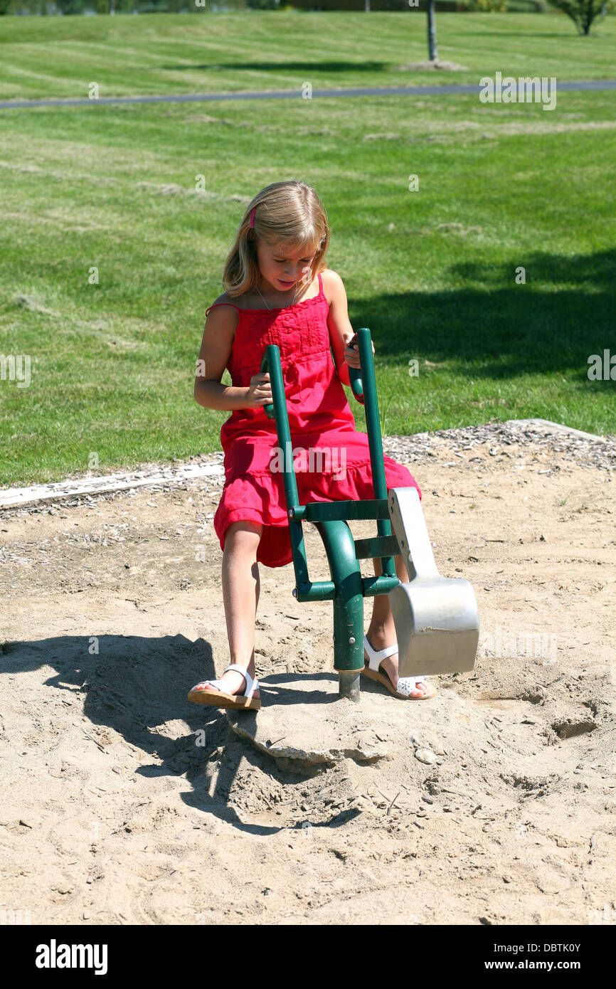 cute blond girl playing in sand at park Stock Photo - Alamy