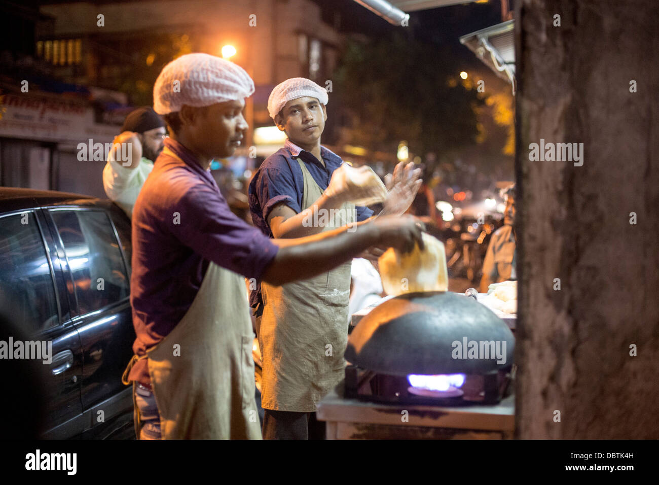 Street food chefs making flat bread paratha dosa Stock Photo