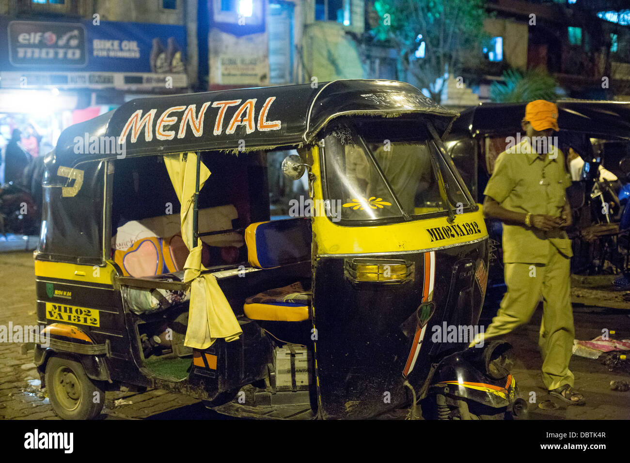 Auto rickshaw tuktuk with sign mental written on side Stock Photo