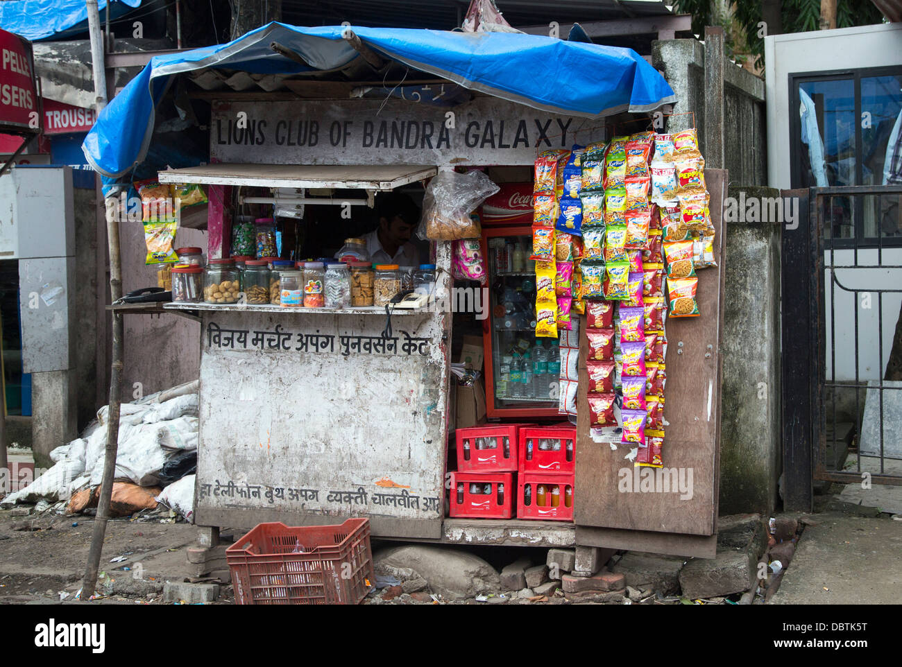 Small outlet selling sweets nuts and crisps stall roadside street Stock Photo