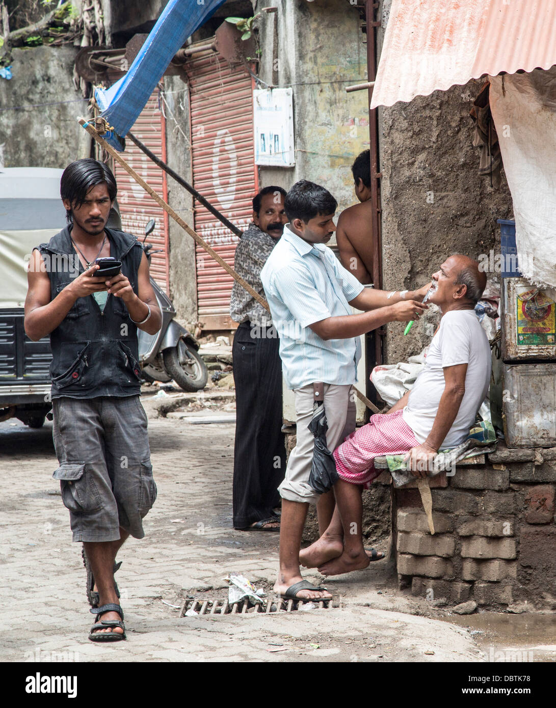 On street barbers shop in Mumbai village commerce Stock Photo