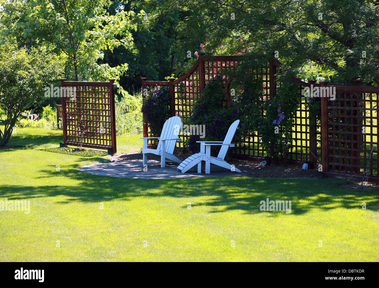 peaceful backyard retreat with flowers and chairs Stock Photo - Alamy