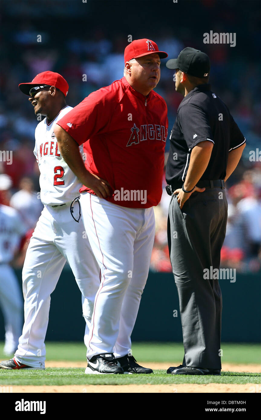 Anaheim, California, USA. 4th Aug, 2013. August 4, 2013 Anaheim, California: Los Angeles Angels manager Mike Scioscia (14) argues the umpires call of Toronto Blue Jays third baseman Brett Lawrie (13) being safe after Los Angeles Angels shortstop Erick Aybar (2) attempted to tag him out at second base during the Major League Baseball game between the Toronto Blue Jays and the Los Angeles Angels at Angel Stadium on August 4, 2013 in Anaheim, California. Rob Carmell/CSM/Alamy Live News Stock Photo