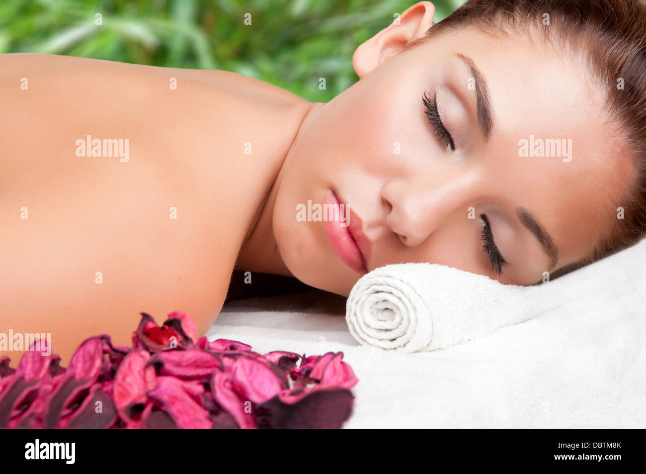 Young woman lying in a spa ready to get a massage Stock Photo