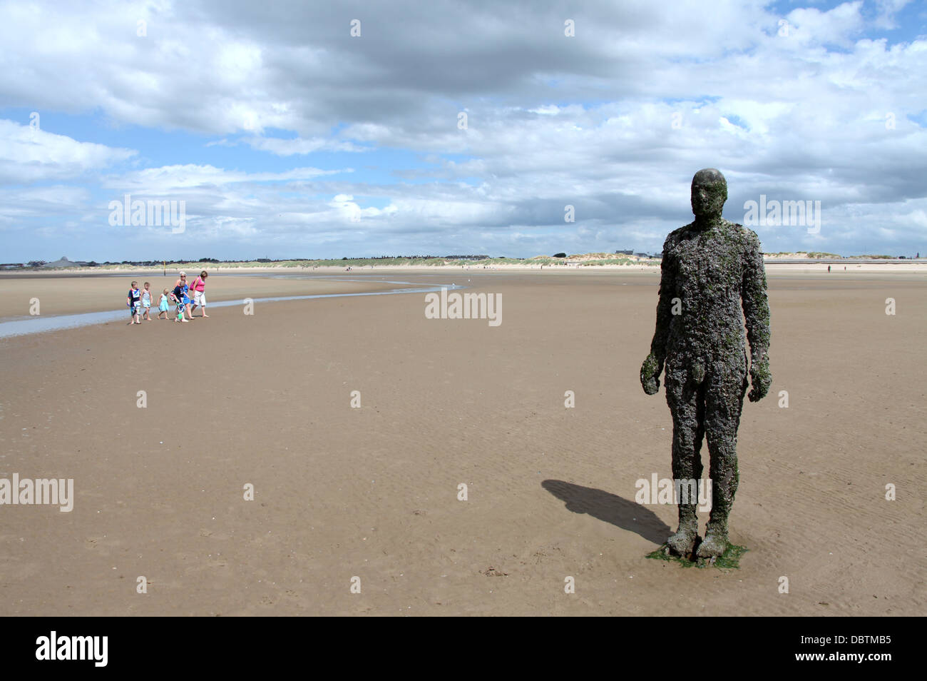 Another Place artwork statue on Crosby Beach in Lancashire Stock Photo