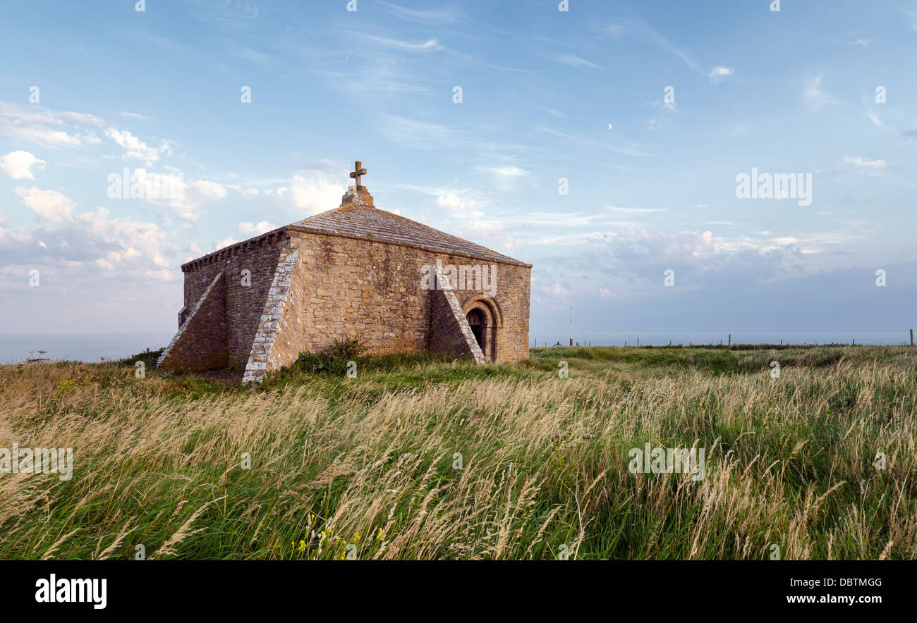 An old chapel perched on the cliffs at St Aldhelm's Head on Dorset's Jurassic Coast Stock Photo