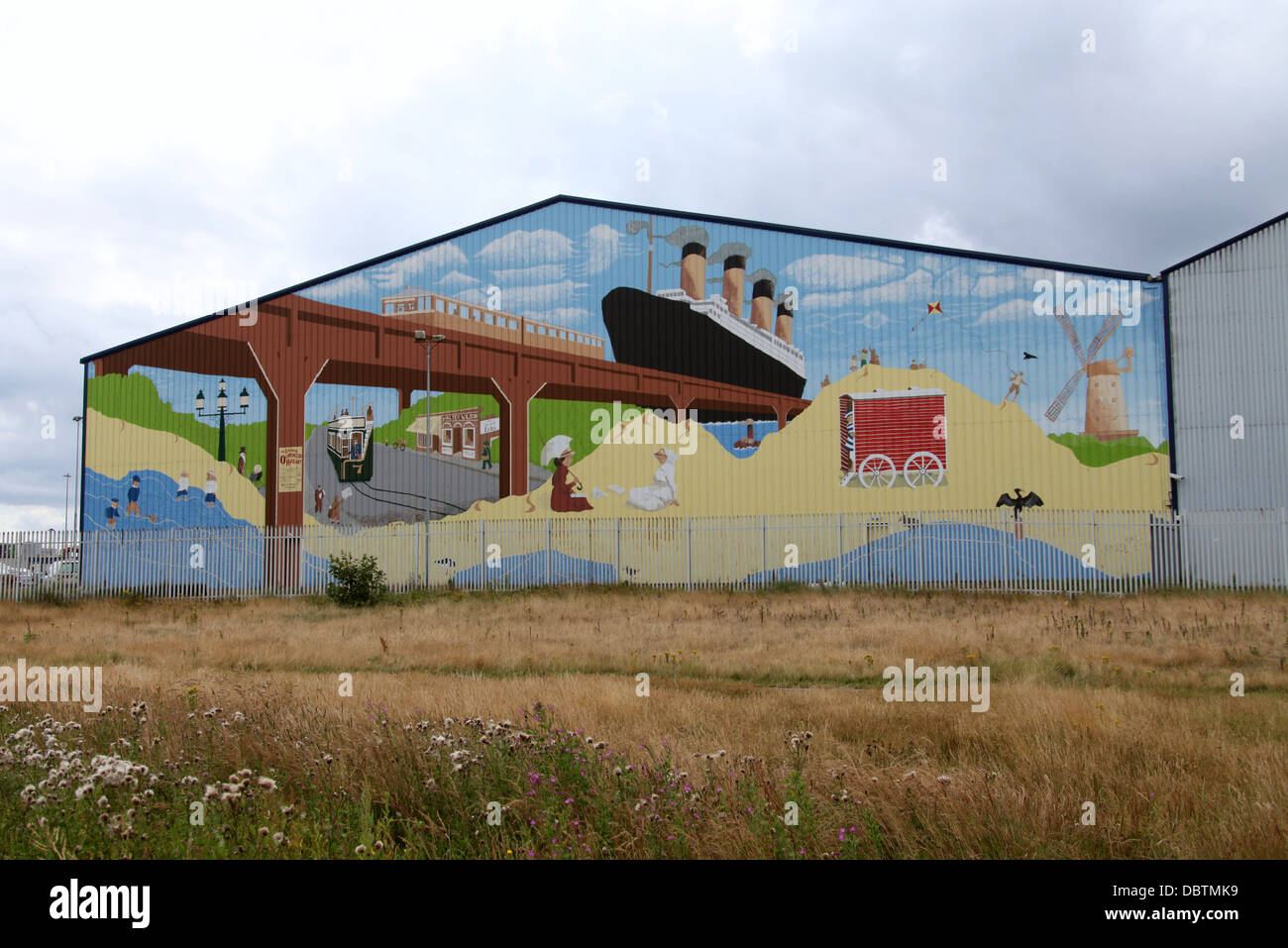 Mural painted on a cocoa shed or warehouse building at Seaforth Dock in Waterloo on Merseyside Stock Photo