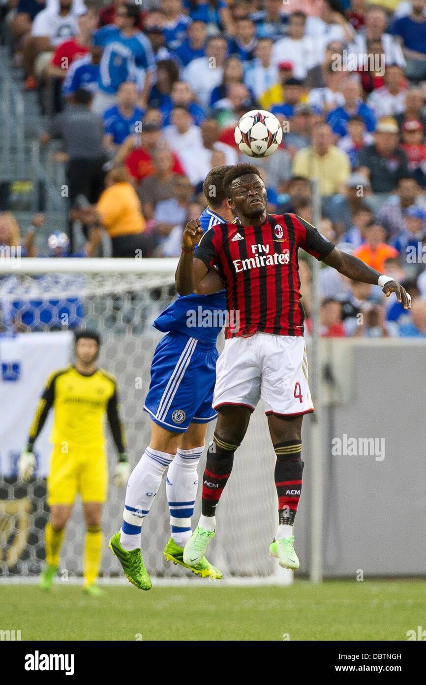East Rutherford, New Jersey, USA 4th Aug, 2013: Milan midfielder Sulley Muntari (4) heads the ball during the Guinness International Champions Cup match between A.C. Milan and Chelsea at Met Life Stadium, East Rutherford, NJ. Credit:  Cal Sport Media/Alamy Live News Stock Photo