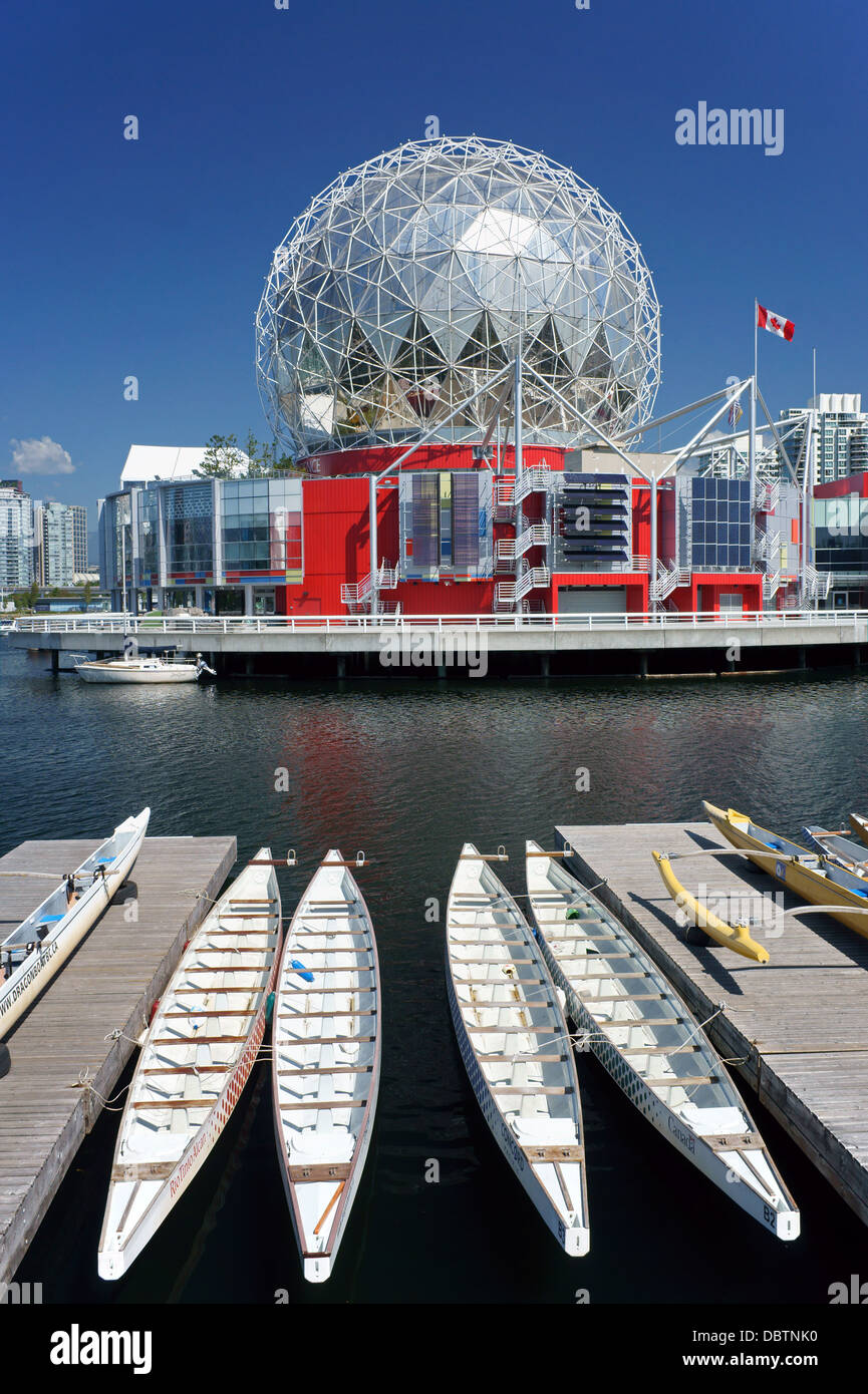 Science World or Telus World of Science and dragon boats moored at False Creek in Vancouver, BC, Canada Stock Photo