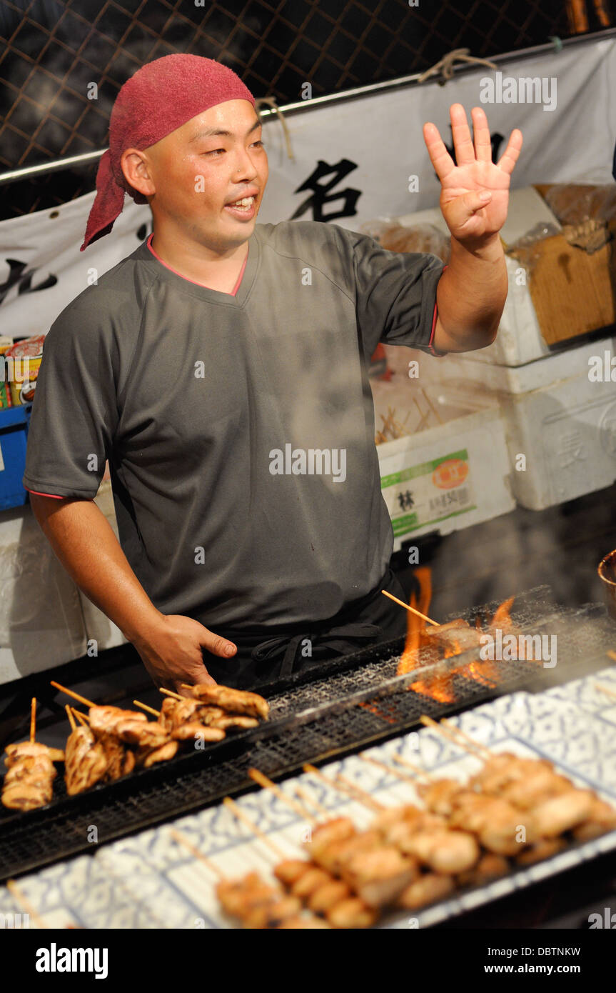 A street seller at the Gion Festival in Kyoto, Japan. Stock Photo