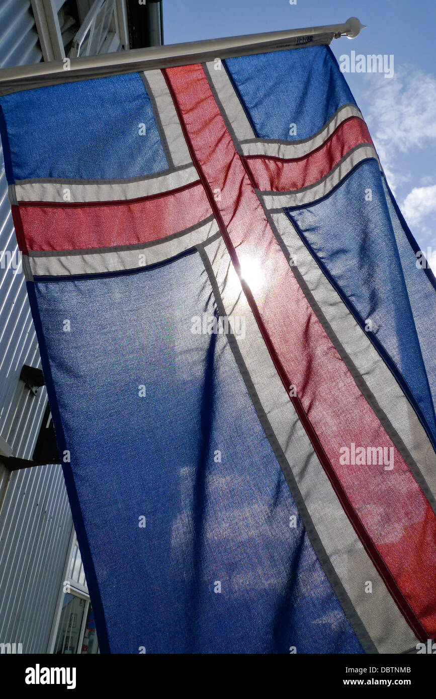 The Iceland flag with the sun behind it. Stock Photo