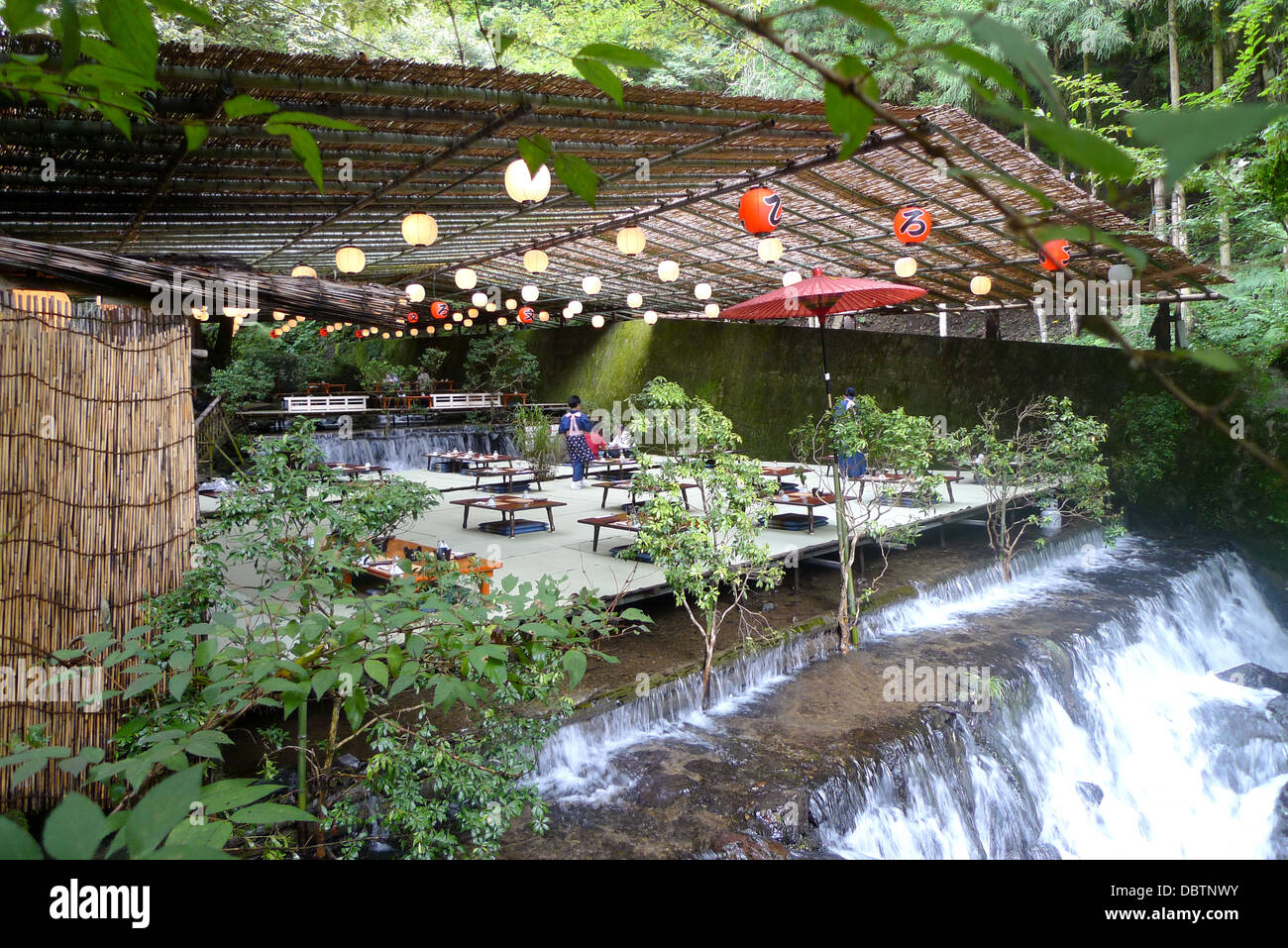 A 'kawadoko' dining deck built over a river running through Kibune in Kyoto, Japan. Stock Photo