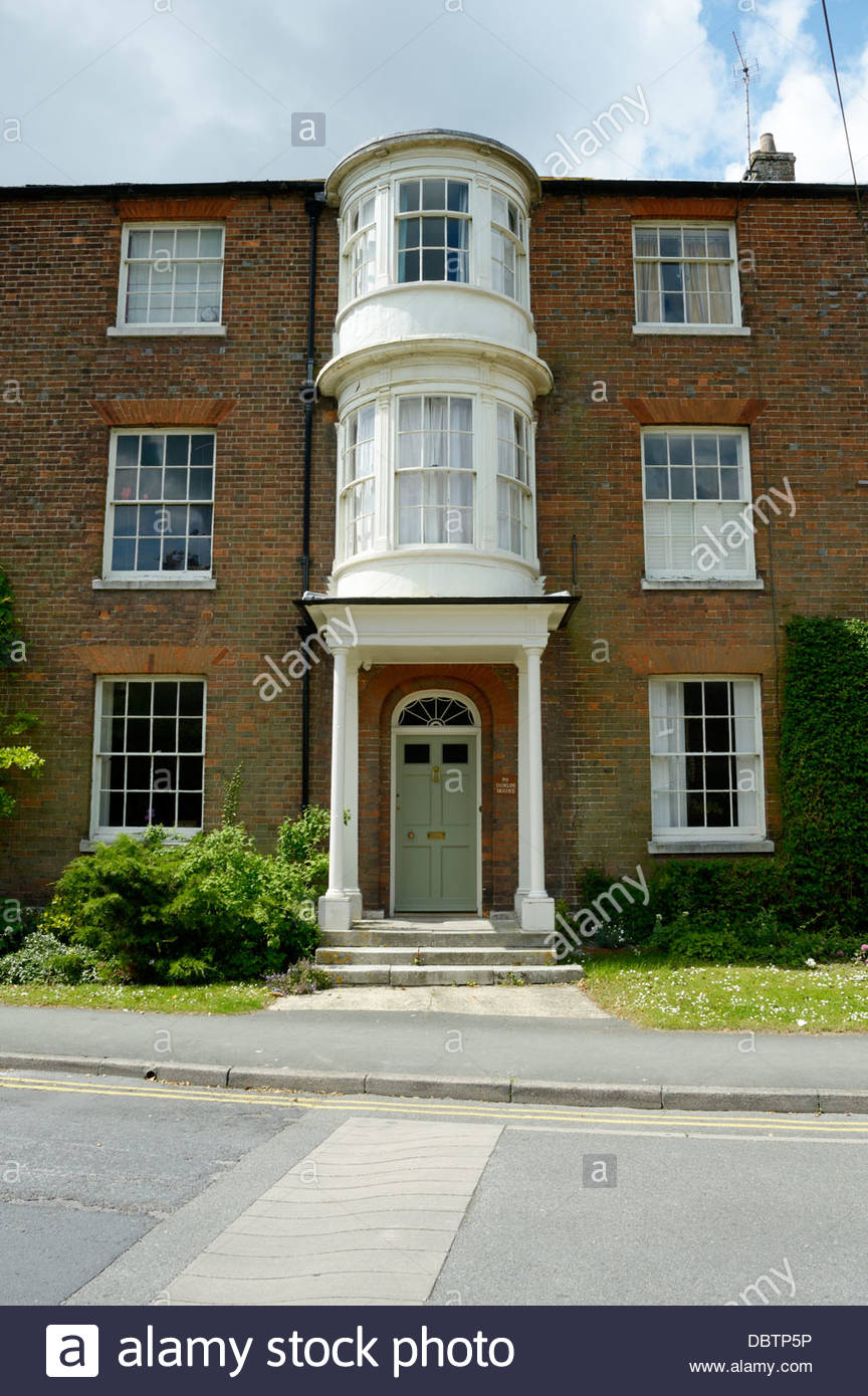 Three Storey Double Fronted House With Bay Windows Above The