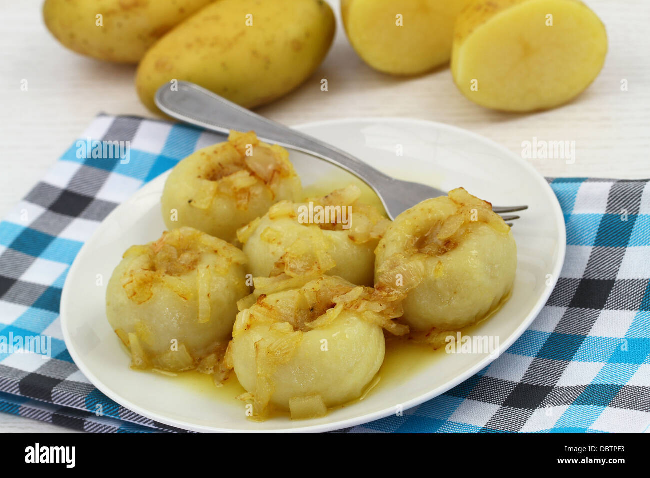 Potato dumplings with fried onions Stock Photo Alamy
