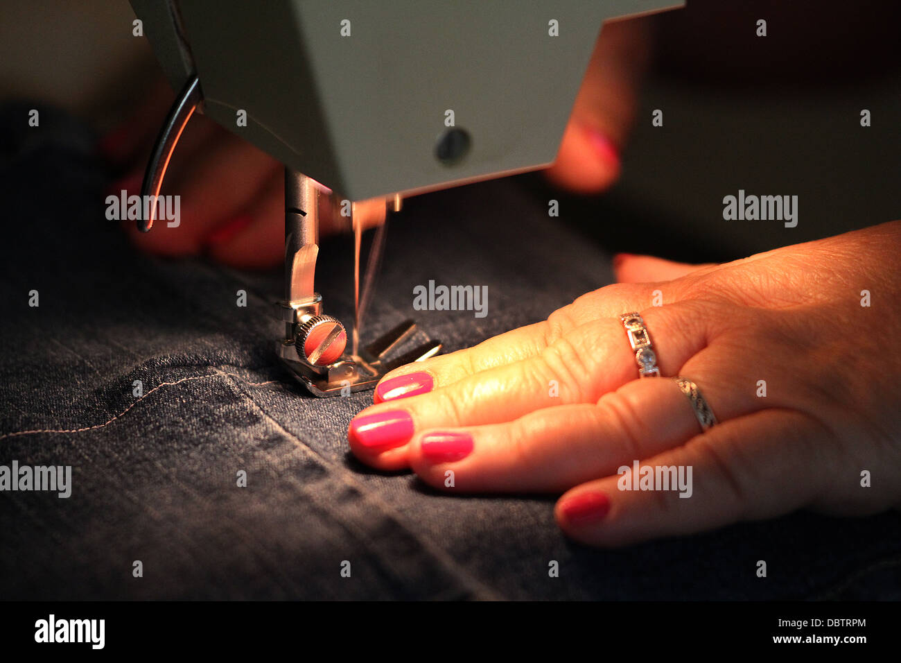 Sewing machine in use. Stock Photo