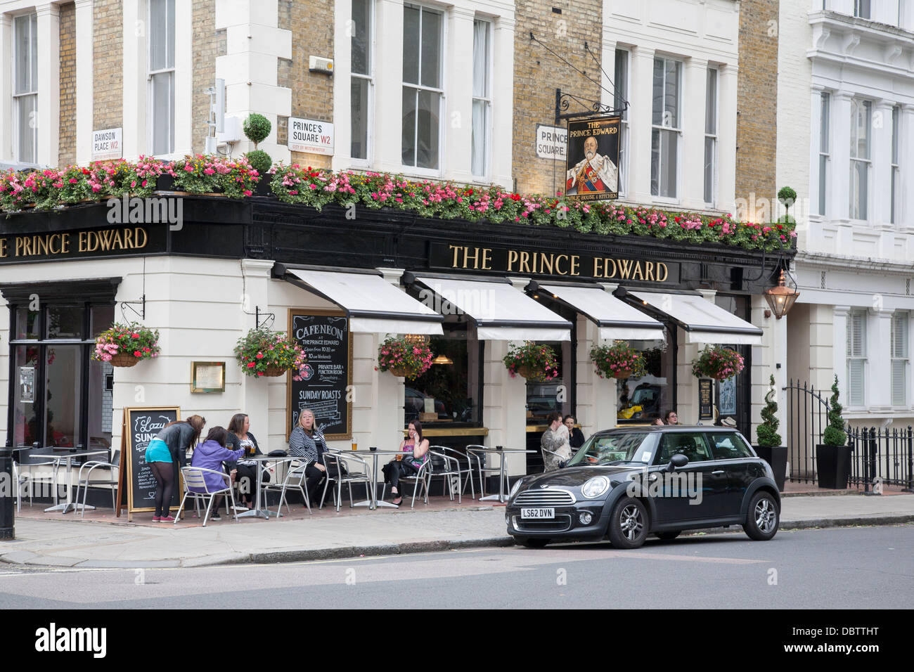People Drinking outside Prince Edward Pub, Princes Square, London