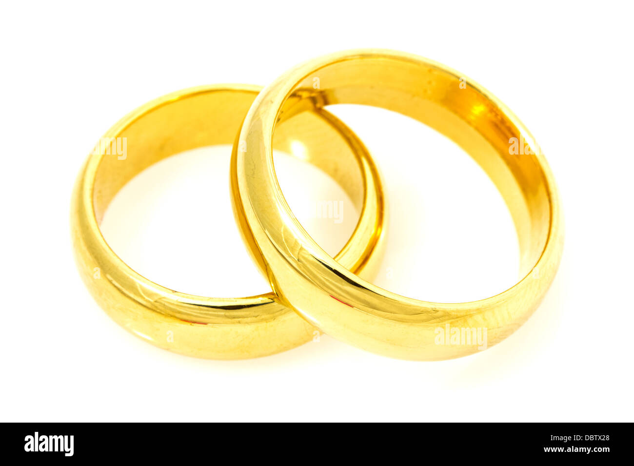 Pair of golden wedding rings on a white background Stock Photo Alamy