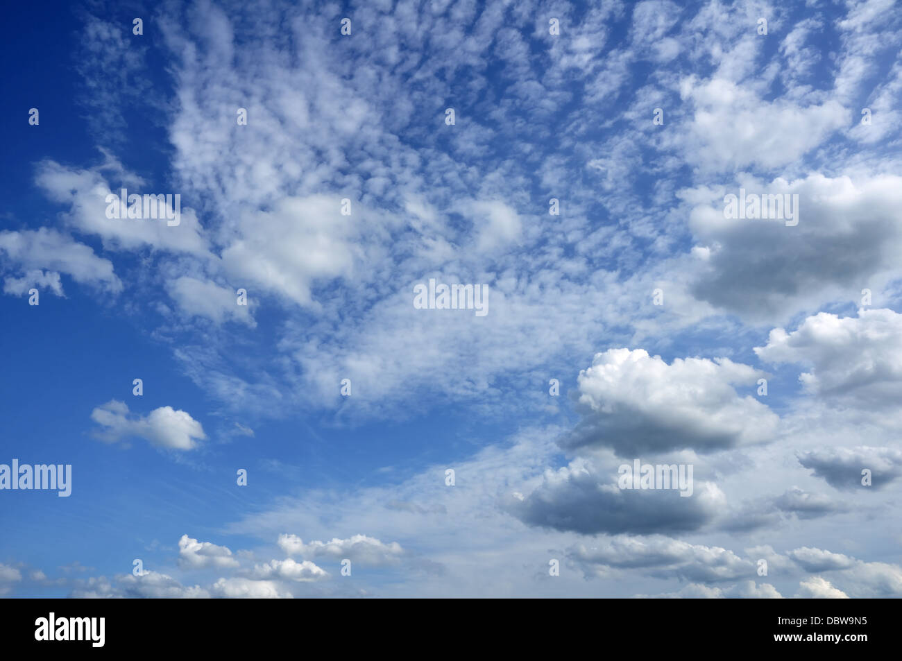 Cumulus and Altocumulus Clouds in a Blue Sky Stock Photo
