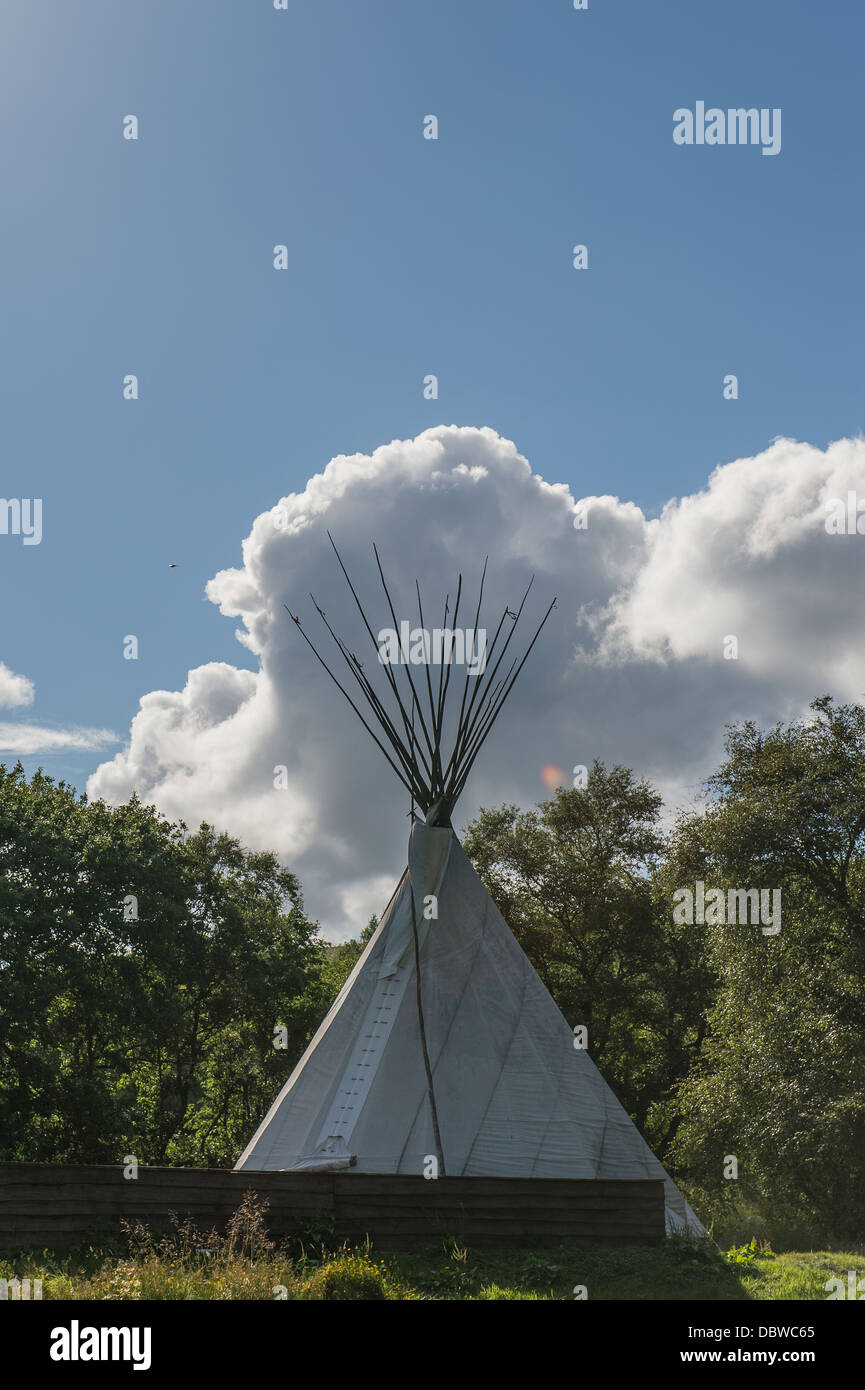 Tepee with cloud in background Stock Photo