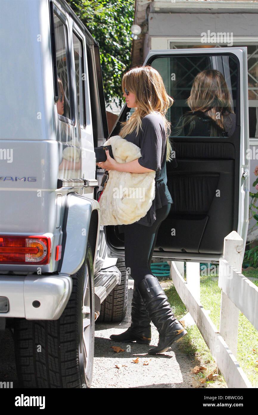 Hilary Duff gets into a Mercedes-Benz SUV outside a private residence ...